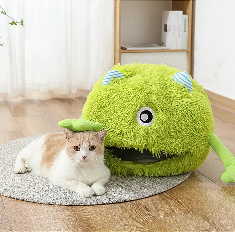 Fluffy round plush cat bed with a non-slip base, shown in a home setting.