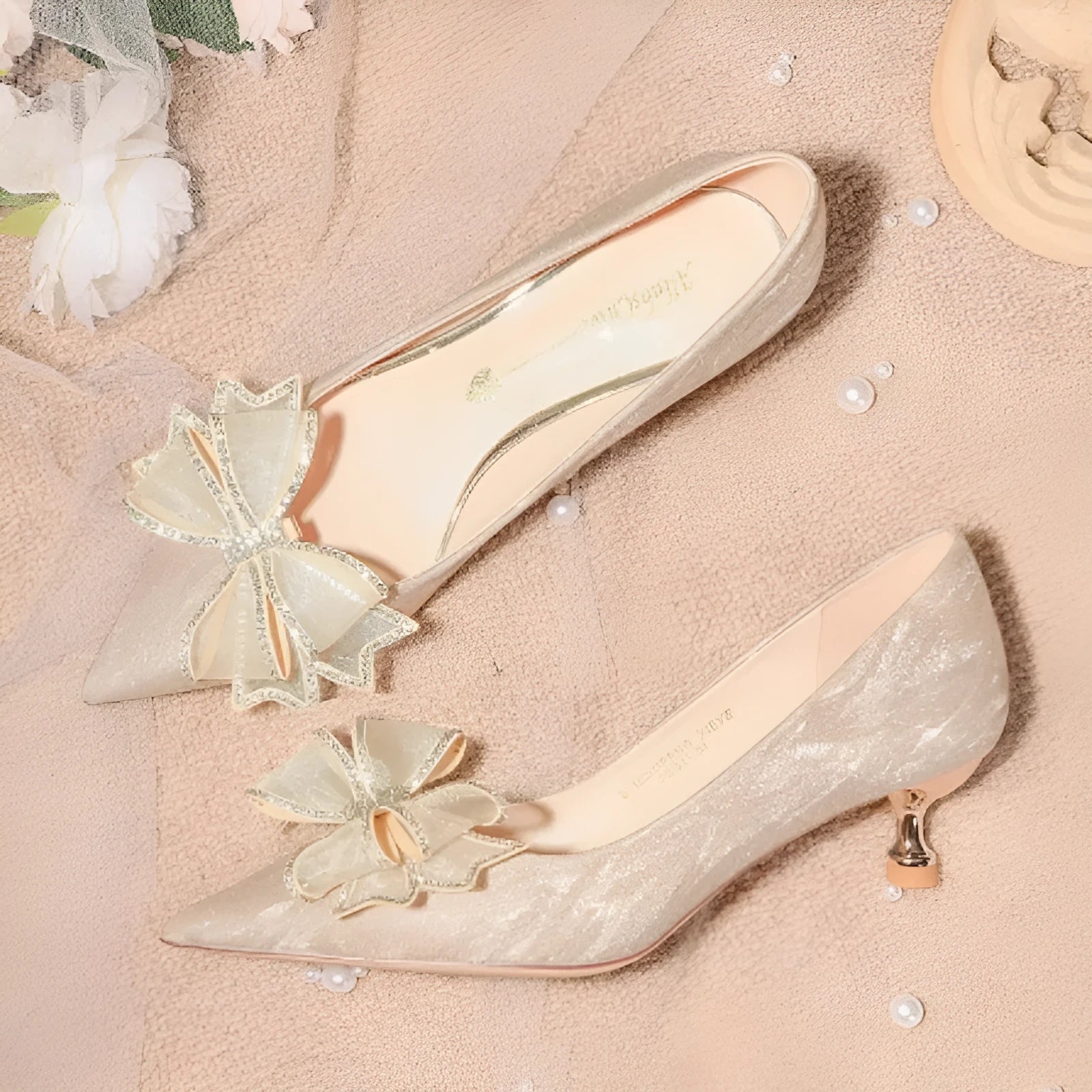 Champagne sequin pointed toe stiletto high heels with crystal detailing on low-cut vamp