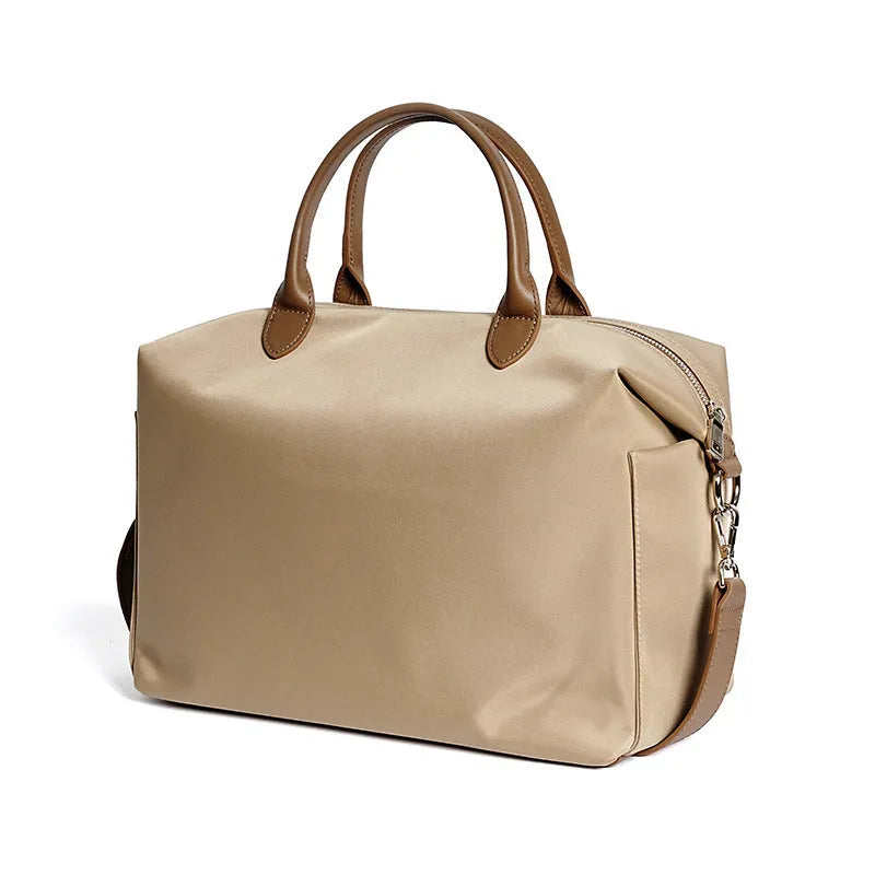 Nylon waterproof shoulder bag in black or light khaki colour measuring 35cm wide