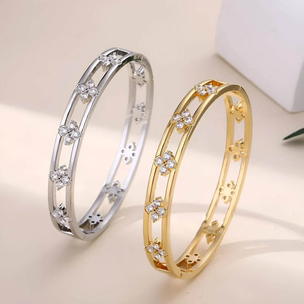 Women's hollow bracelet with four-leaf clover design and zircon stones in gold or silver finish