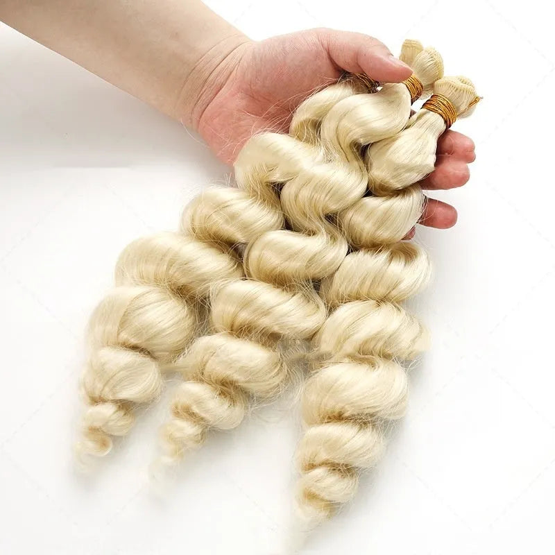 Golden long synthetic wig for women on a stand, showing hair weft construction