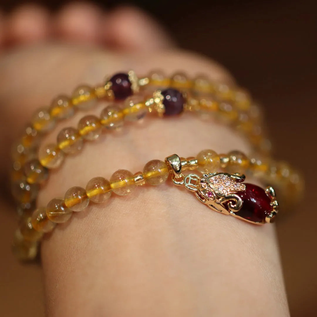 Natural Brazilian gold rutilated quartz bracelet with three circles and hanging chopsticks design