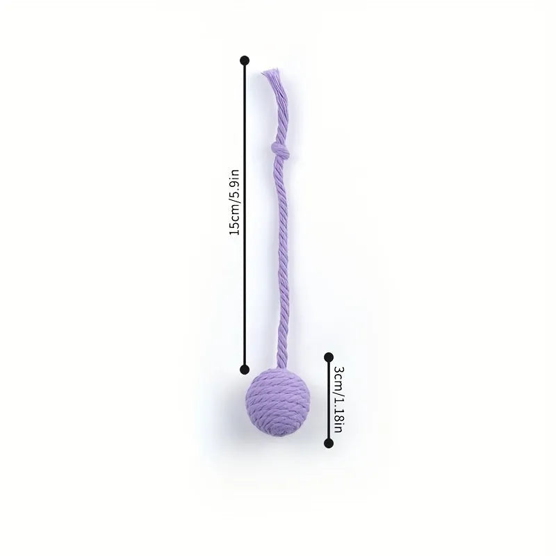 Cat toy ball with attached rope and bell in green, pink, purple or yellow colours showing 6cm and 3cm size comparison