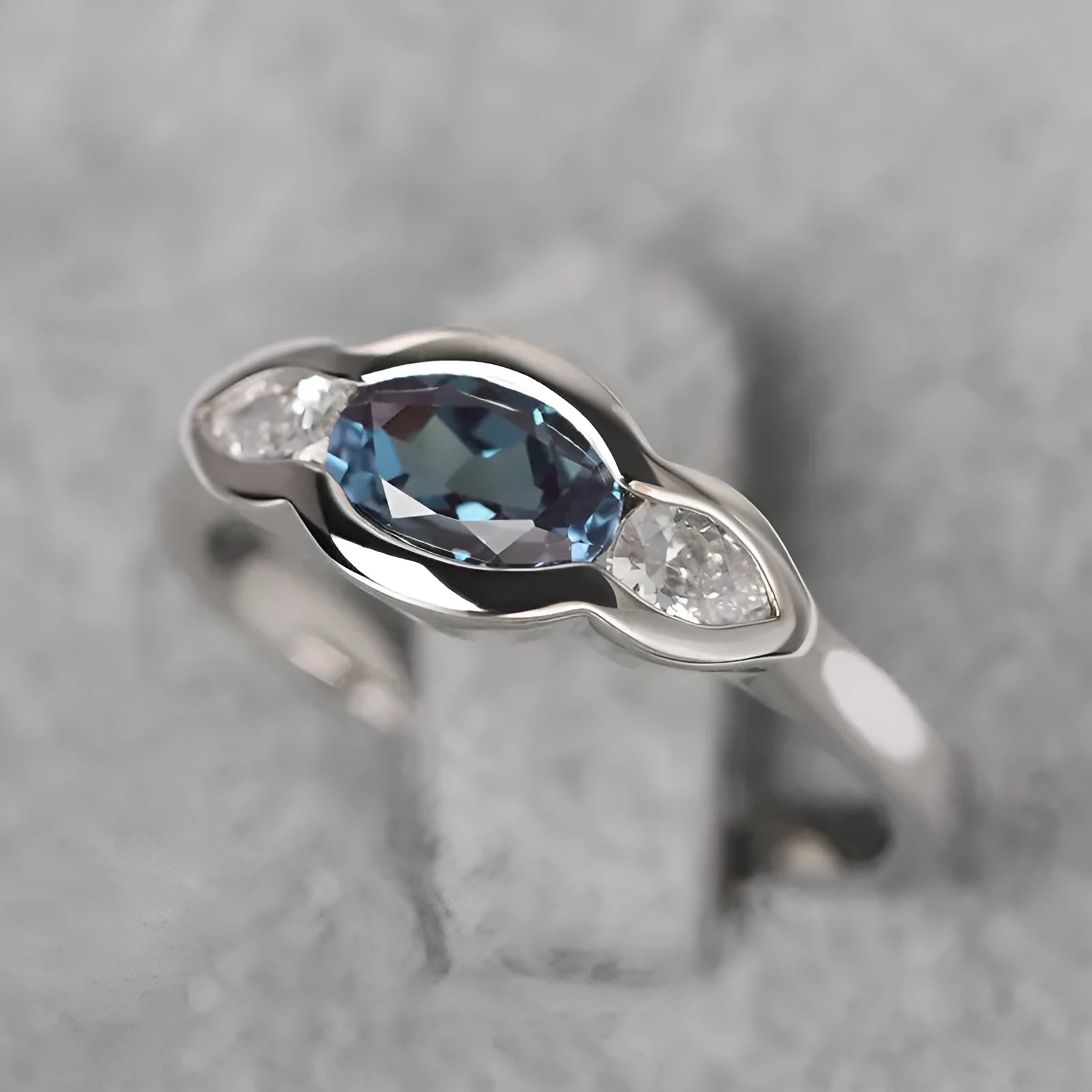 Geometric ellipse women's ring with inlaid zircon stone in white gold plating