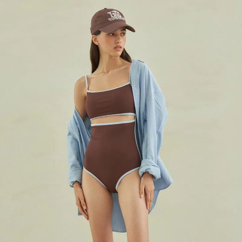 Brown triangle-style one-piece swimsuit for women on a mannequin.