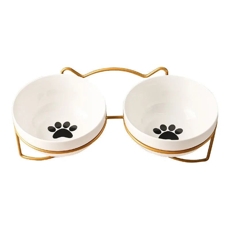 White ceramic cat bowl with decorative pattern and black iron frame support