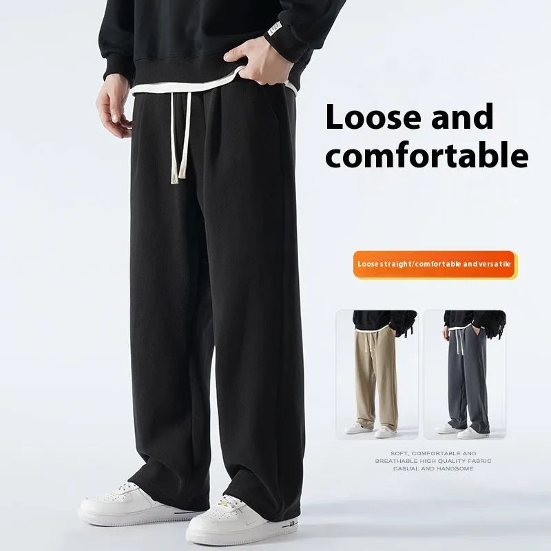 Men's apricot coloured loose-fit polar fleece trousers with a drawstring waistband, shown laid flat.