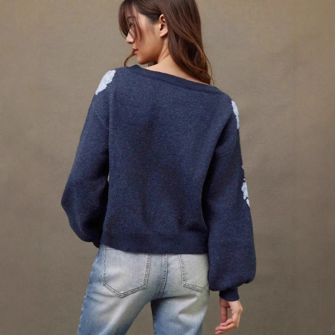 Sapphire blue women's loose pullover sweater with a detailed woven floral jacquard pattern and off-neck design.