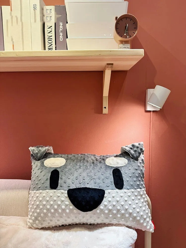 Grey Schnauzer design dog cushion pillow on a sofa, measuring 50cm long