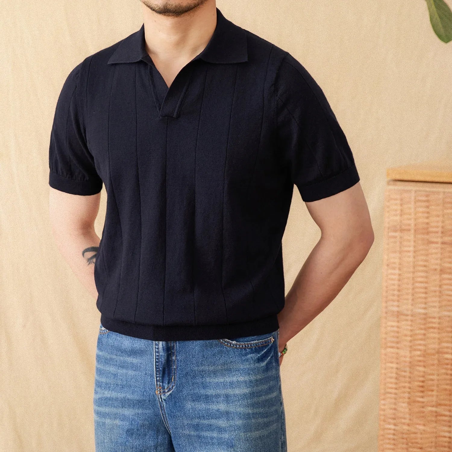 Short sleeve knitted polo shirt in a ramie-cotton blend with a seagull collar, shown in purple.