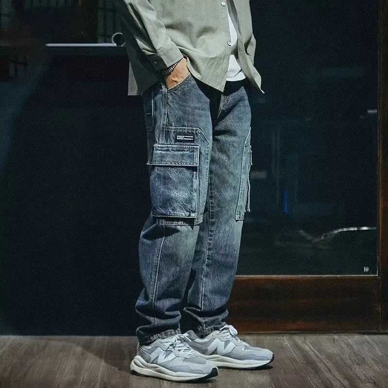 Blue men's loose fit straight-leg jeans with a zip fly on a mannequin