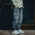 Blue men's loose fit straight-leg jeans with a zip fly on a mannequin