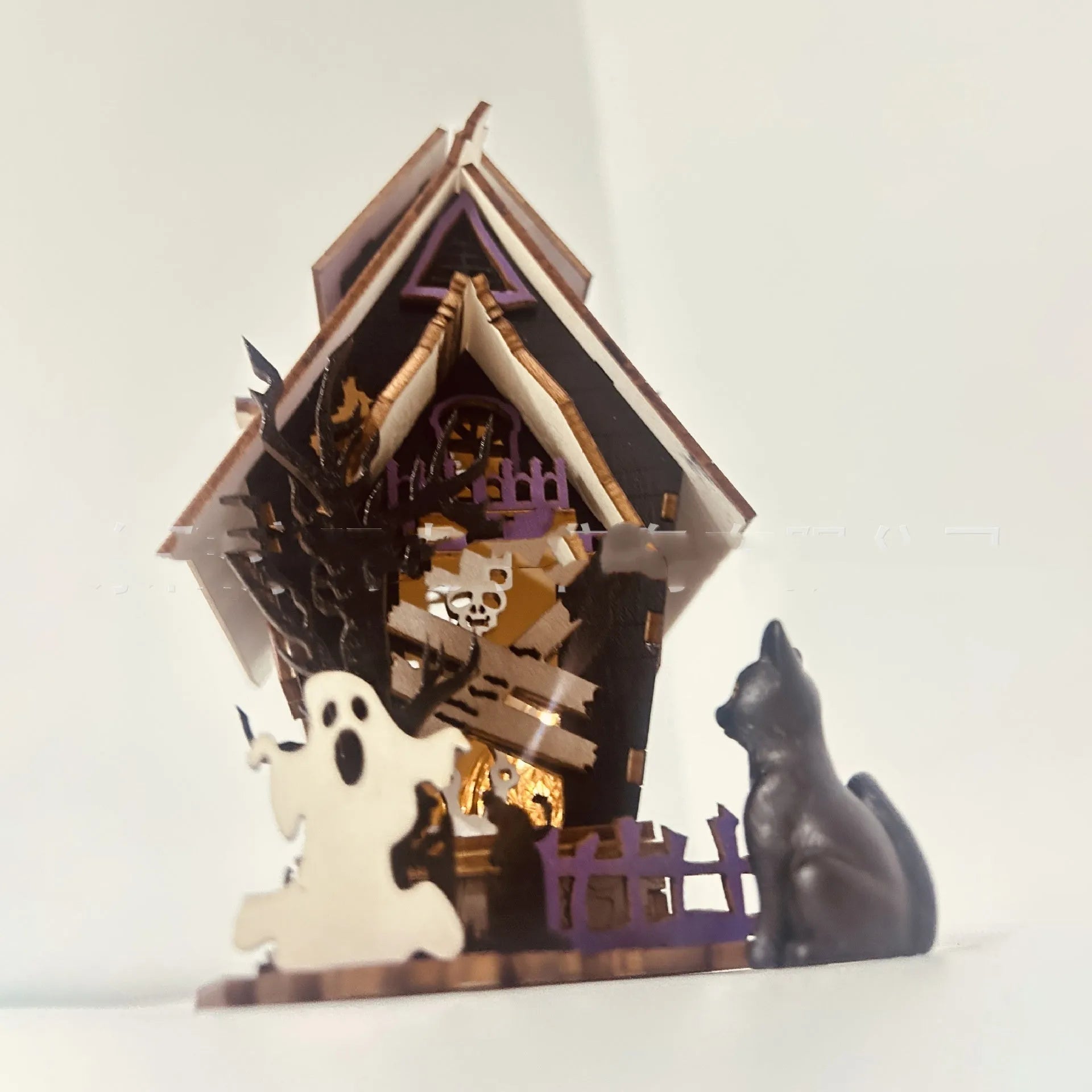 Wooden haunted house decoration with candlestick functionality measuring 14x10.5x19cm for Halloween table displays