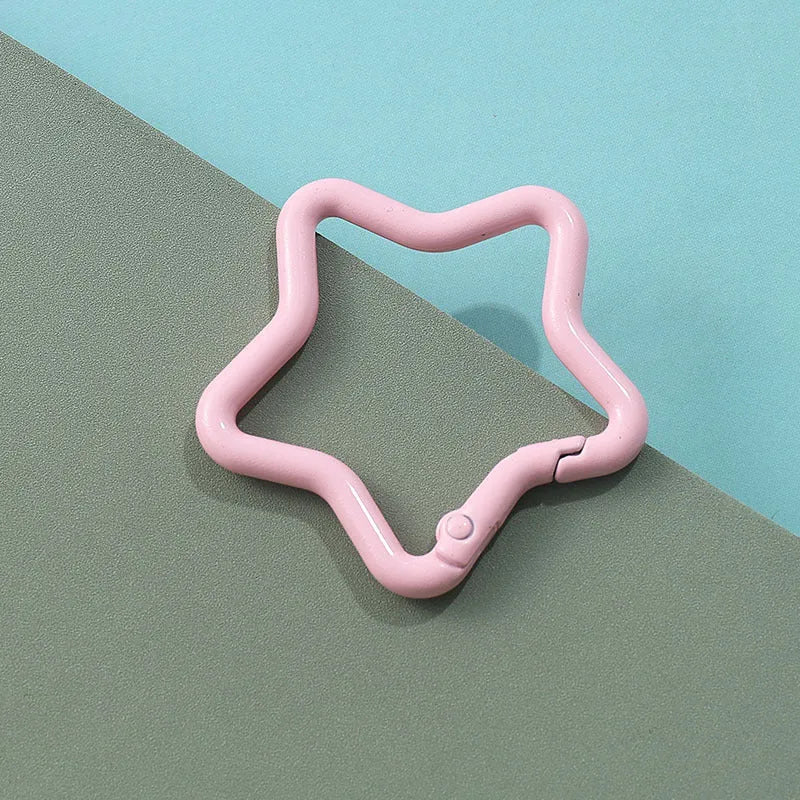 Zinc alloy five-pointed star keychain in light pink, one of ten available macaron colours.