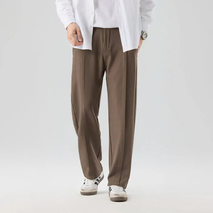 Men's casual loose straight-leg pants in solid colour with mid-high elastic waist and button fly front, available in plus sizes