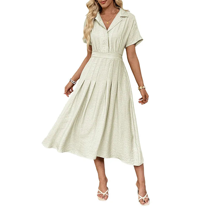 Light green women's shirt dress with lapel collar, waist tie, and side pockets on a model.