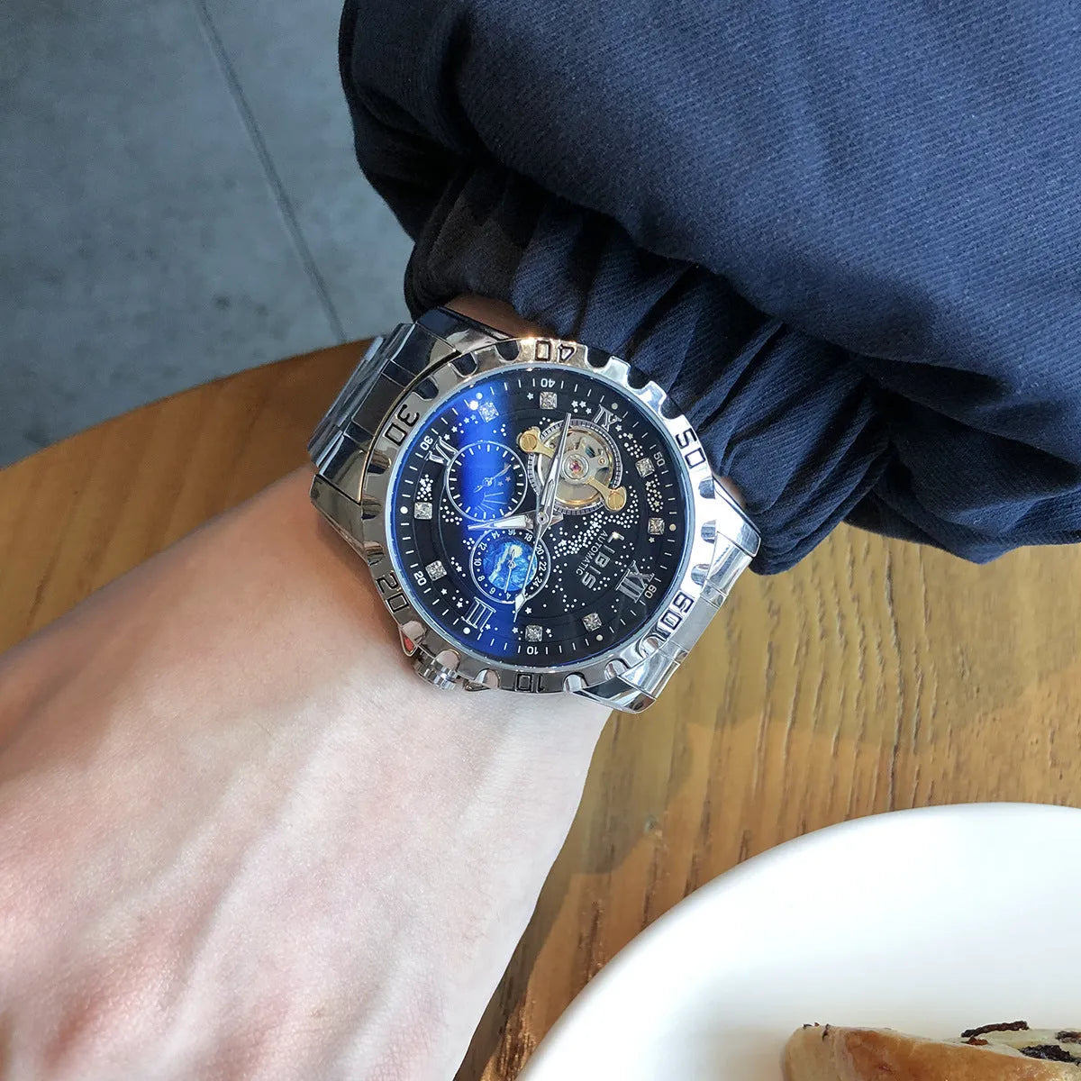 Men's silver automatic mechanical watch with black starry dial and steel bracelet