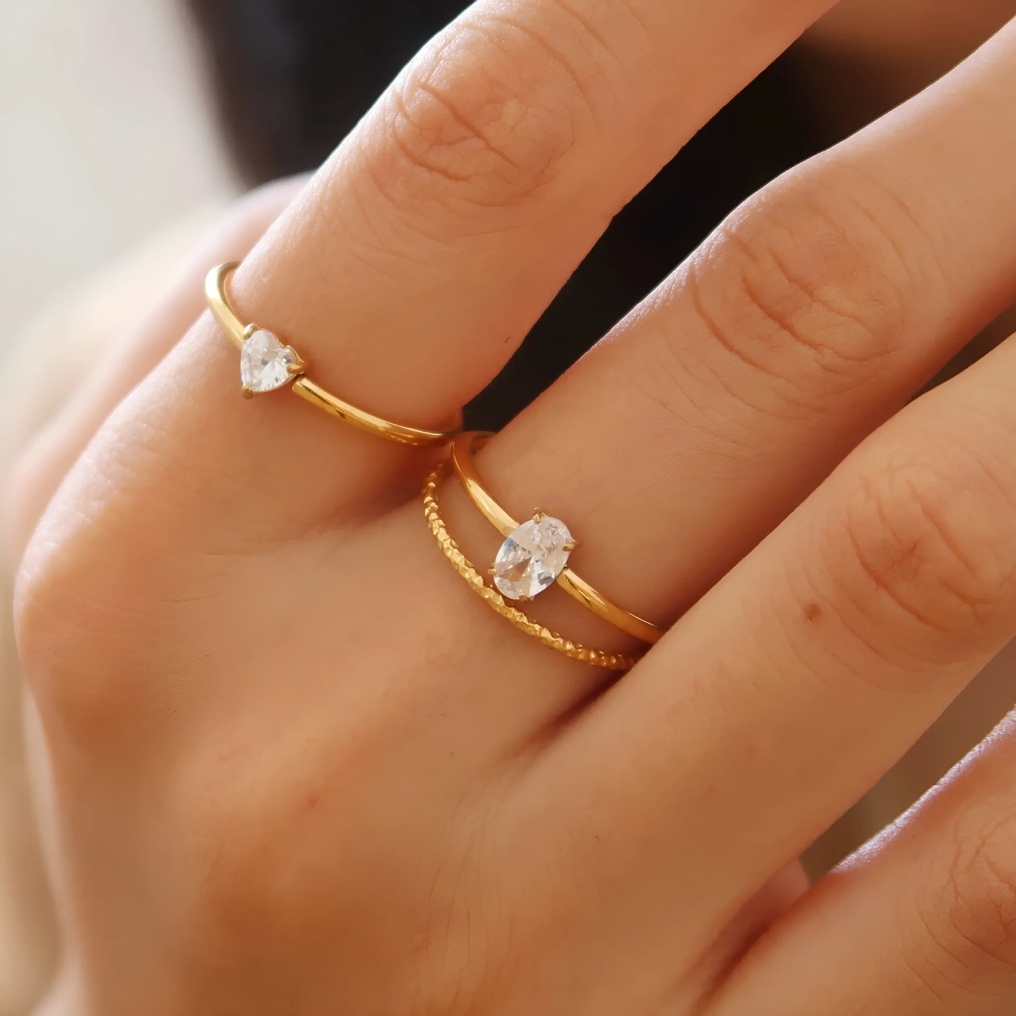 Golden stainless steel ring with either love heart or oval charm on simple band