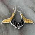 Women's white gold fishtail earrings with whale elements and retro styling