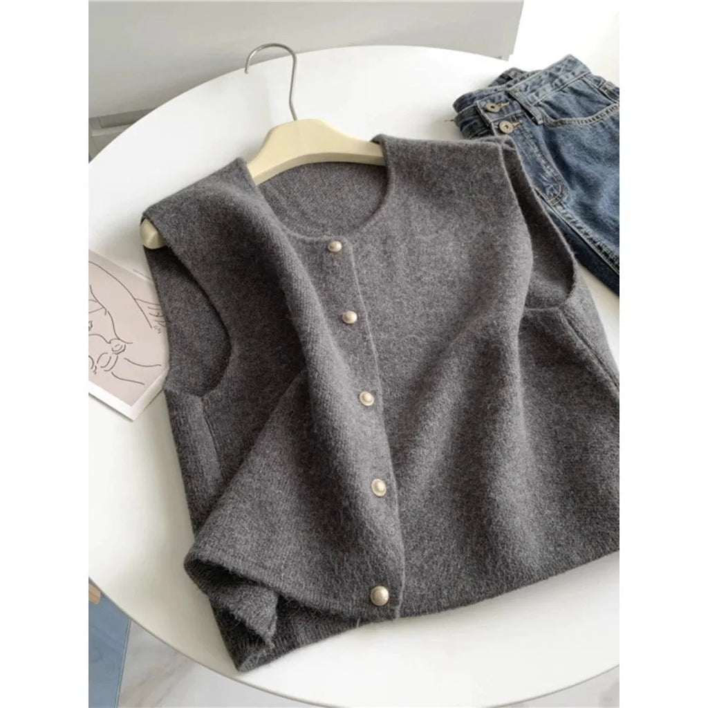 Women's thin polyester pullover vest with half sleeves in a choice of six colours on a hanger.