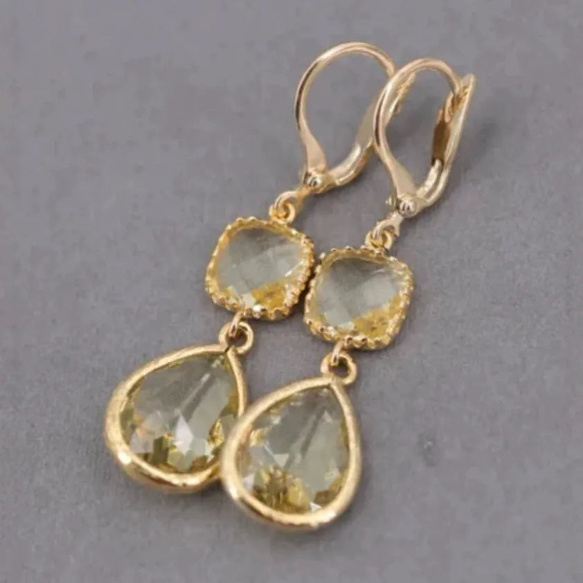 Gold geometric long fringe drop earrings with water droplet crystal decorations on copper material