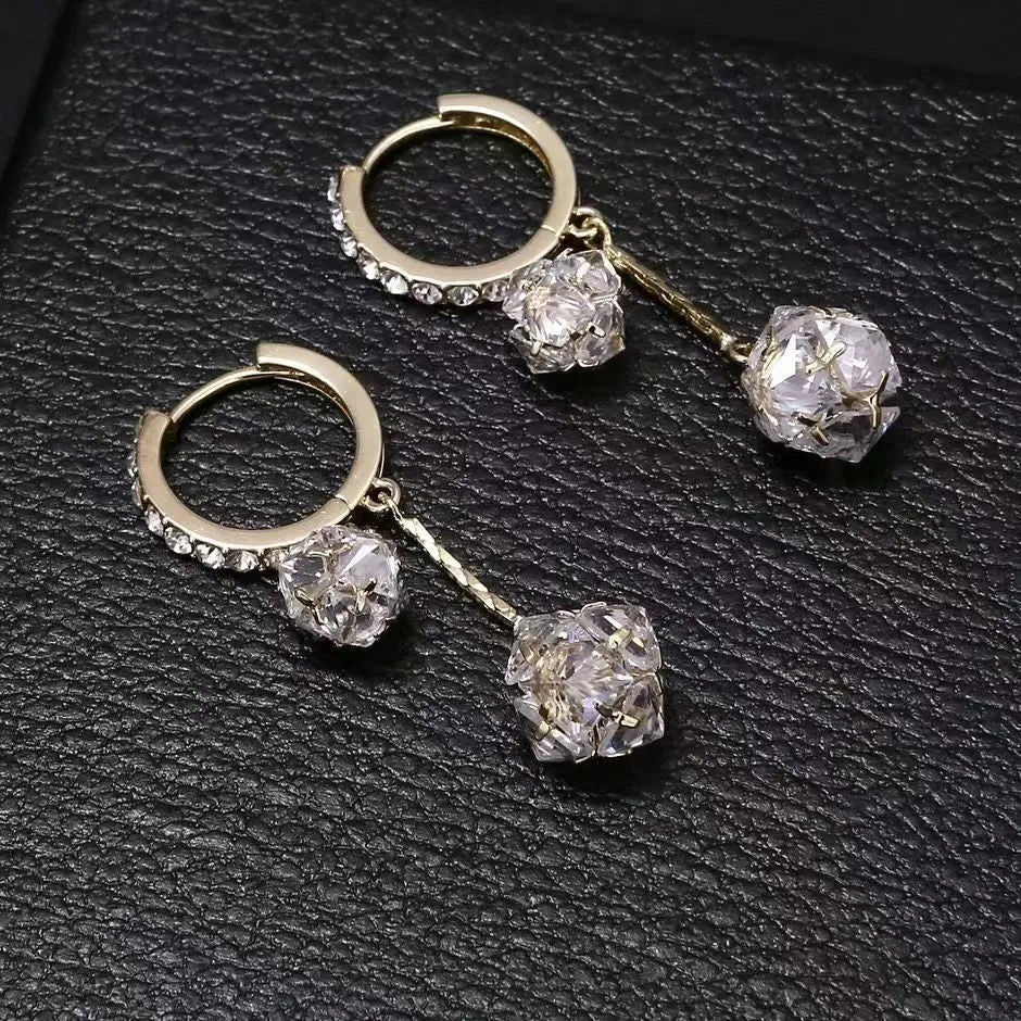 Silver coloured women's earrings with tassel ball and rhinestone ball pendants on ear clips