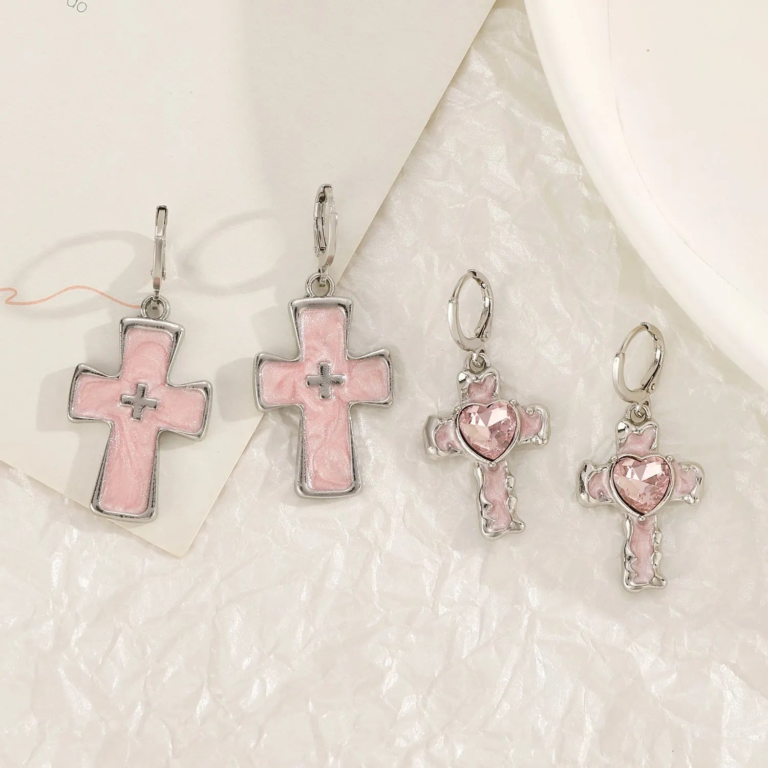 Women's alloy cross crystal earrings in five colour options with cross, heart, and character design elements