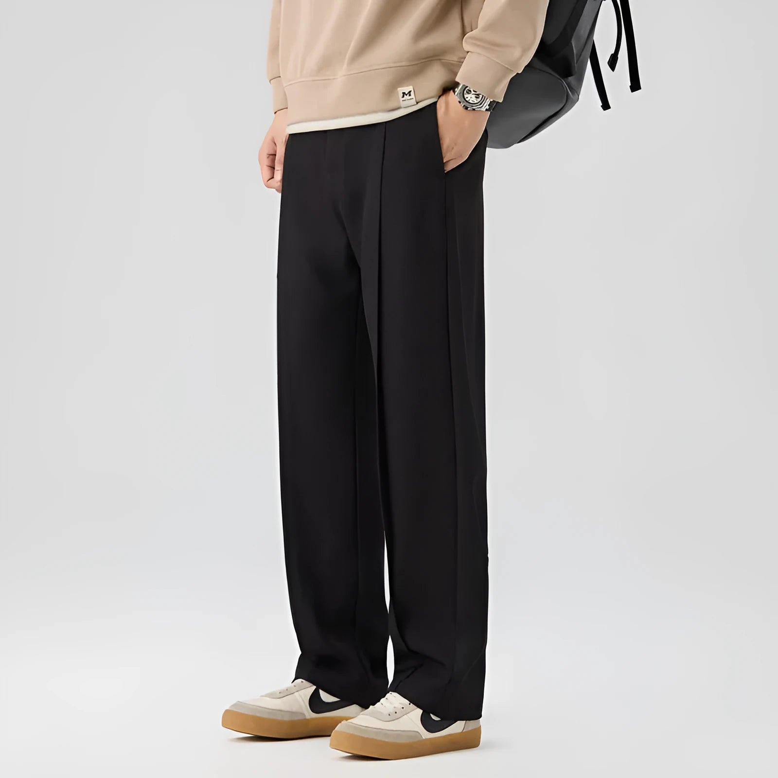 Men's casual loose straight-leg pants in solid colour with mid-high elastic waist and button fly front, available in plus sizes