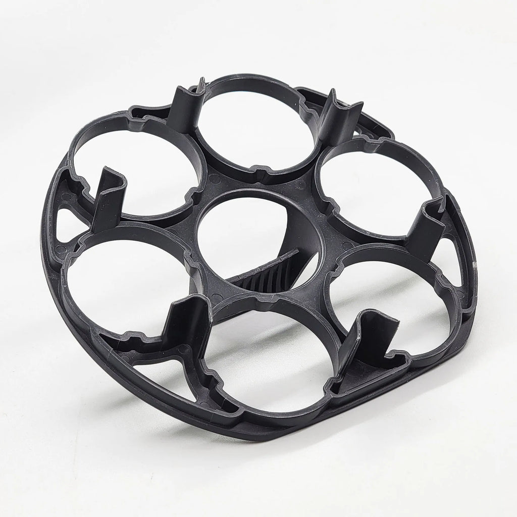 Black plastic egg cooking basket with modern design, shown with dimensions 13.8cm by 12.6cm by 5.7cm.