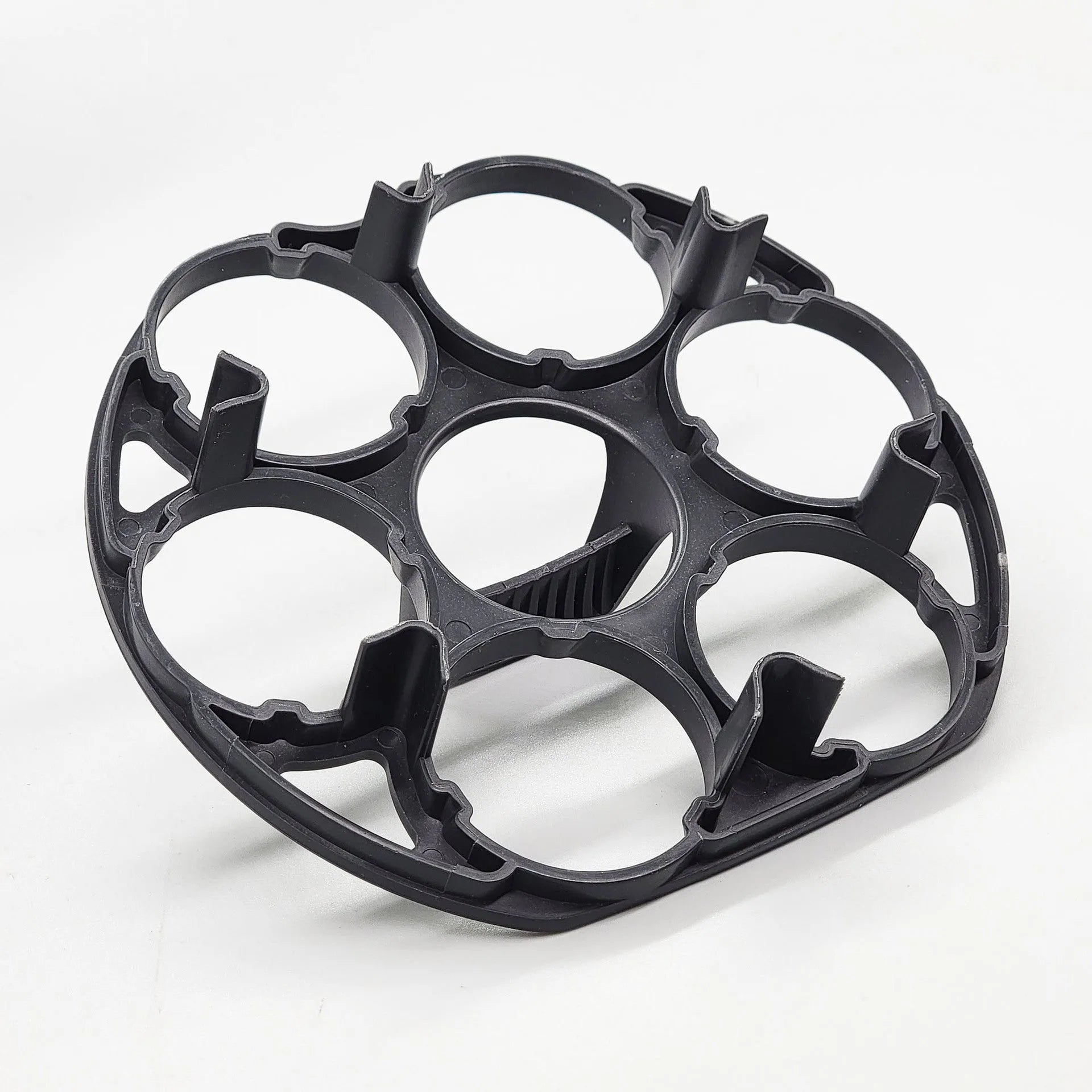 Black plastic egg cooking basket with modern design, shown with dimensions 13.8cm by 12.6cm by 5.7cm.