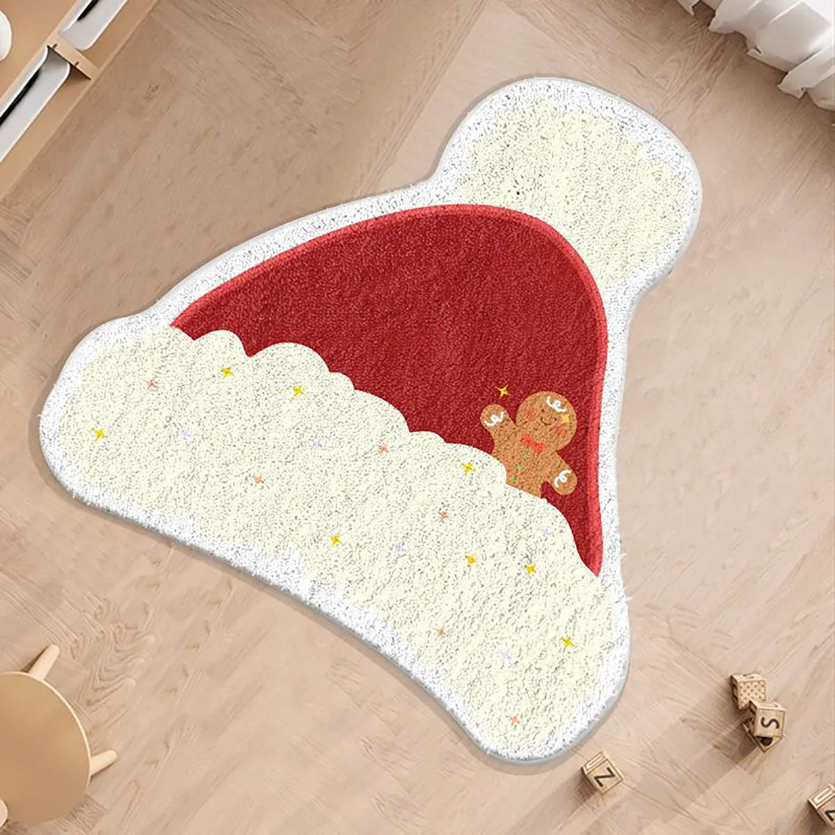 Round alien-shaped Christmas carpet in imitation cashmere, showing one of six festive colour designs.