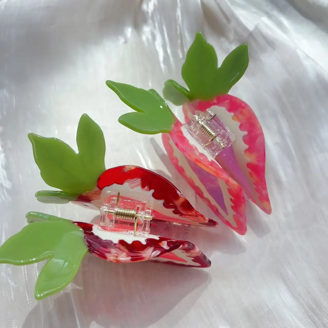 Handmade strawberry design hairpin for girls, shown in red and pink colour options.