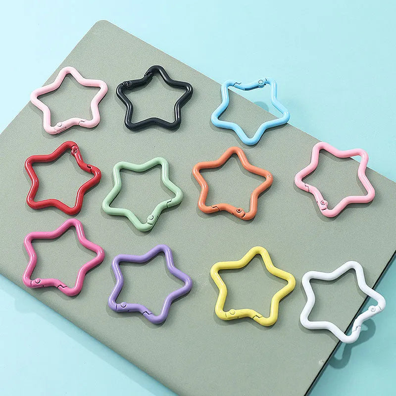 Zinc alloy five-pointed star keychain in light pink, one of ten available macaron colours.