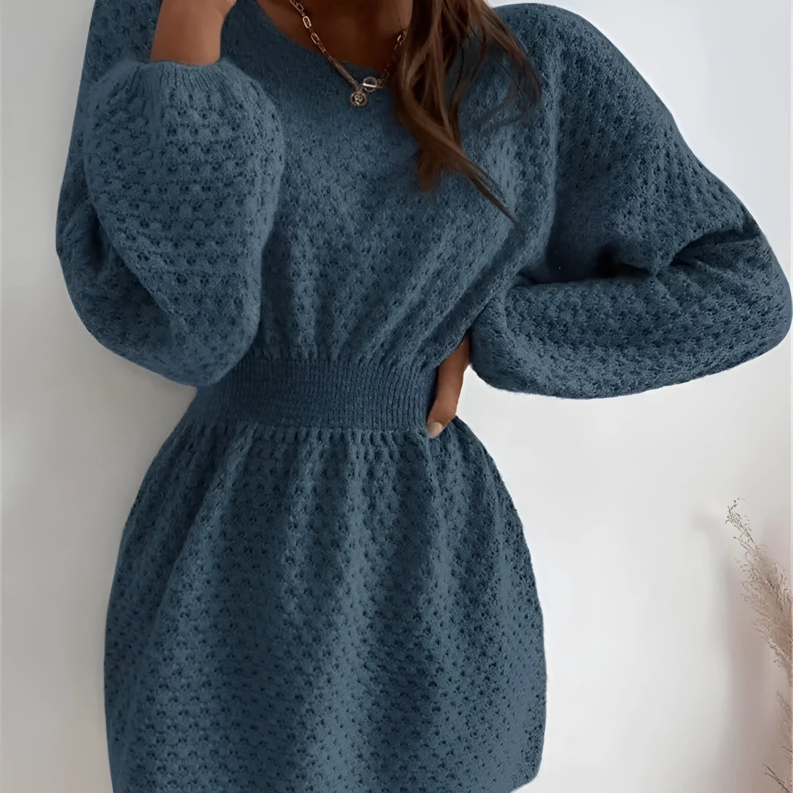 Blue knitted dress with hand-crocheted flowers, French loose neckline and fitted waist
