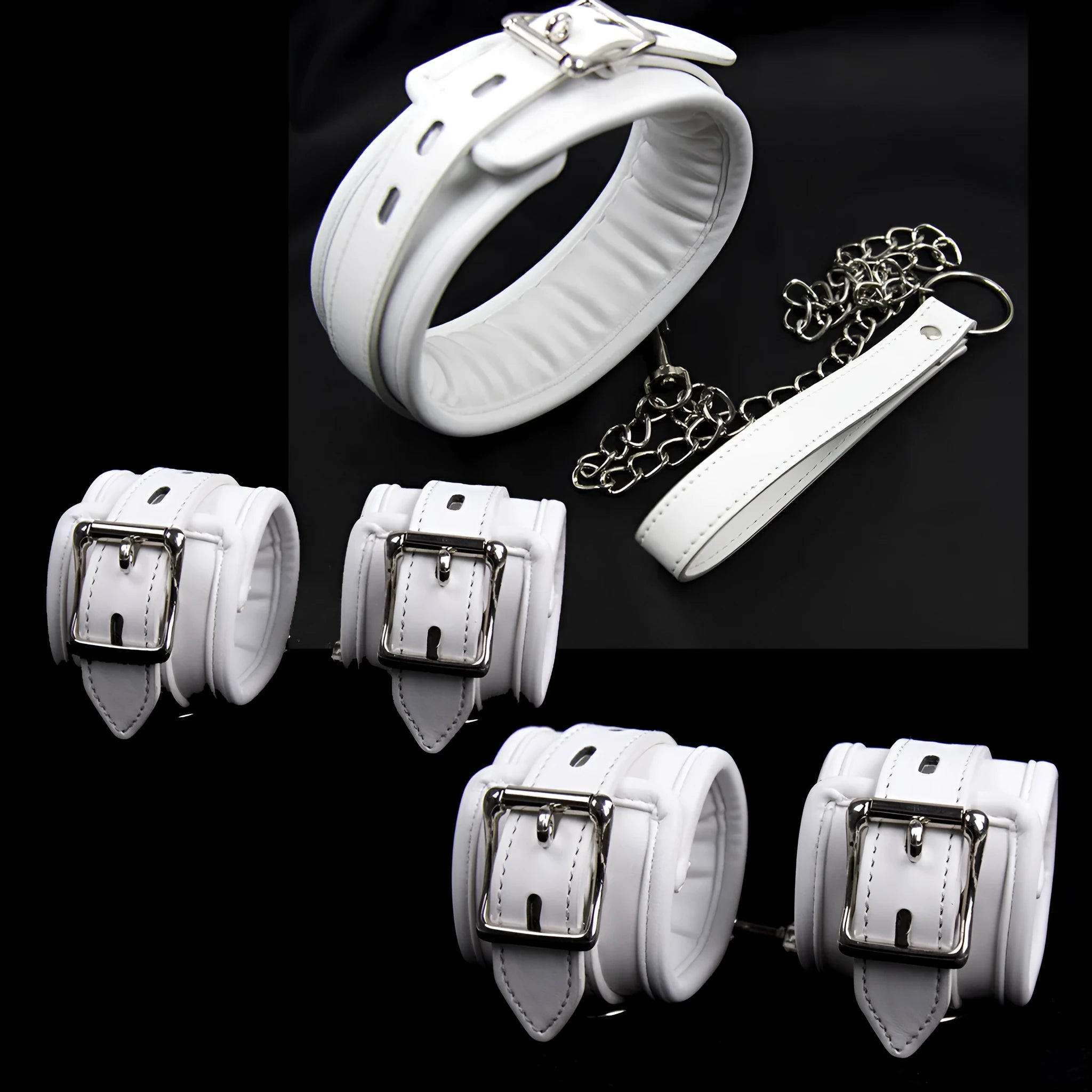 White PU sponge bondage restraint set showing handcuffs, footcuffs, and a neck collar.