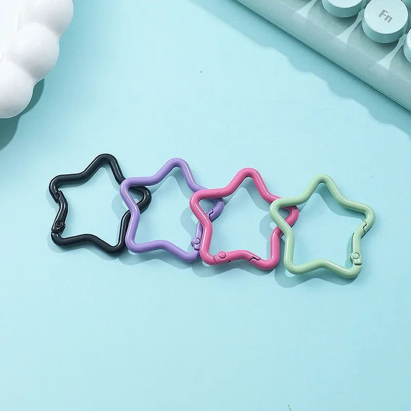 Zinc alloy five-pointed star keychain in light pink, one of ten available macaron colours.
