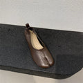 Women's black split toe horseshoe chunky heel pumps with round toe and low heel