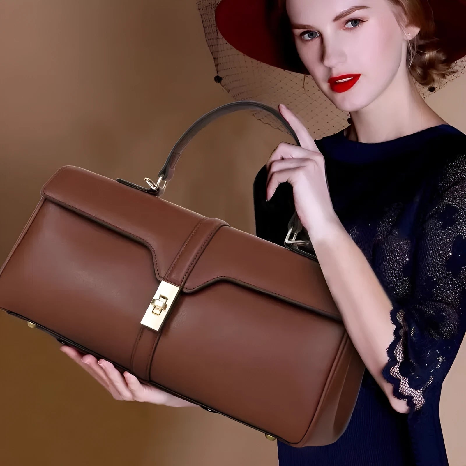 Women's solid colour cowhide leather messenger bag in black, cylindrical shape, with crossbody strap