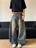 Men's retro blue distressed machete denim jeans with wide-leg silhouette and slim hip fit