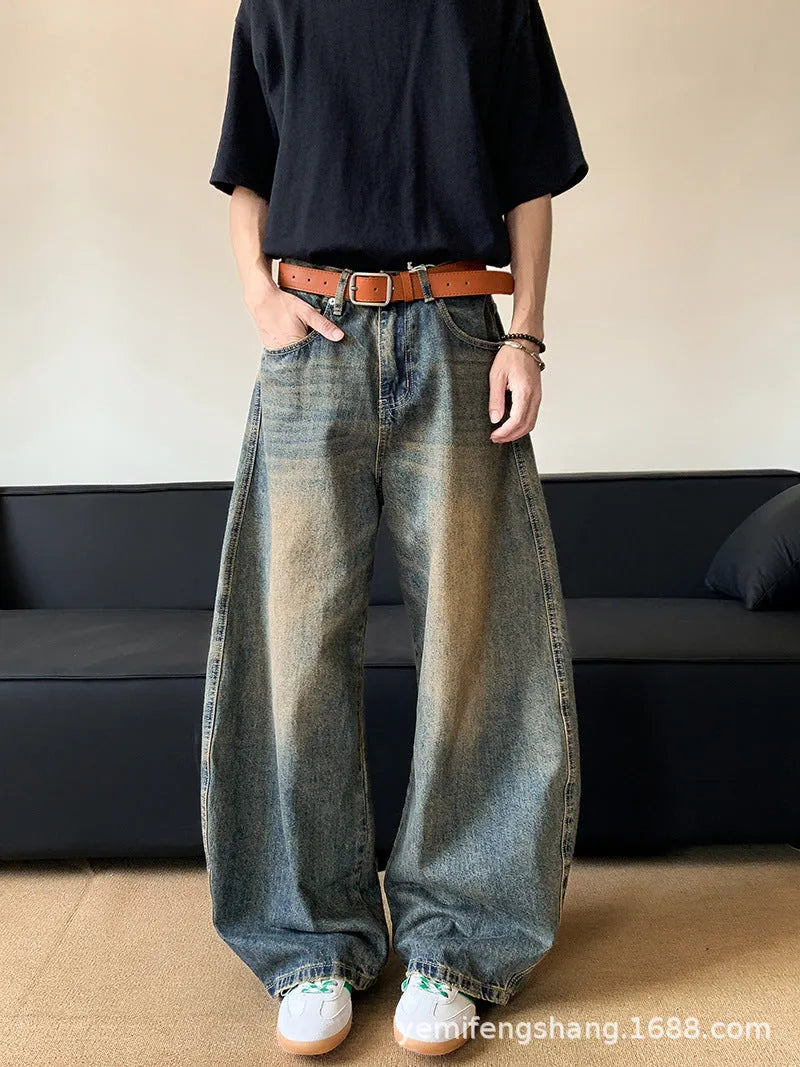 Men's retro blue distressed machete denim jeans with wide-leg silhouette and slim hip fit