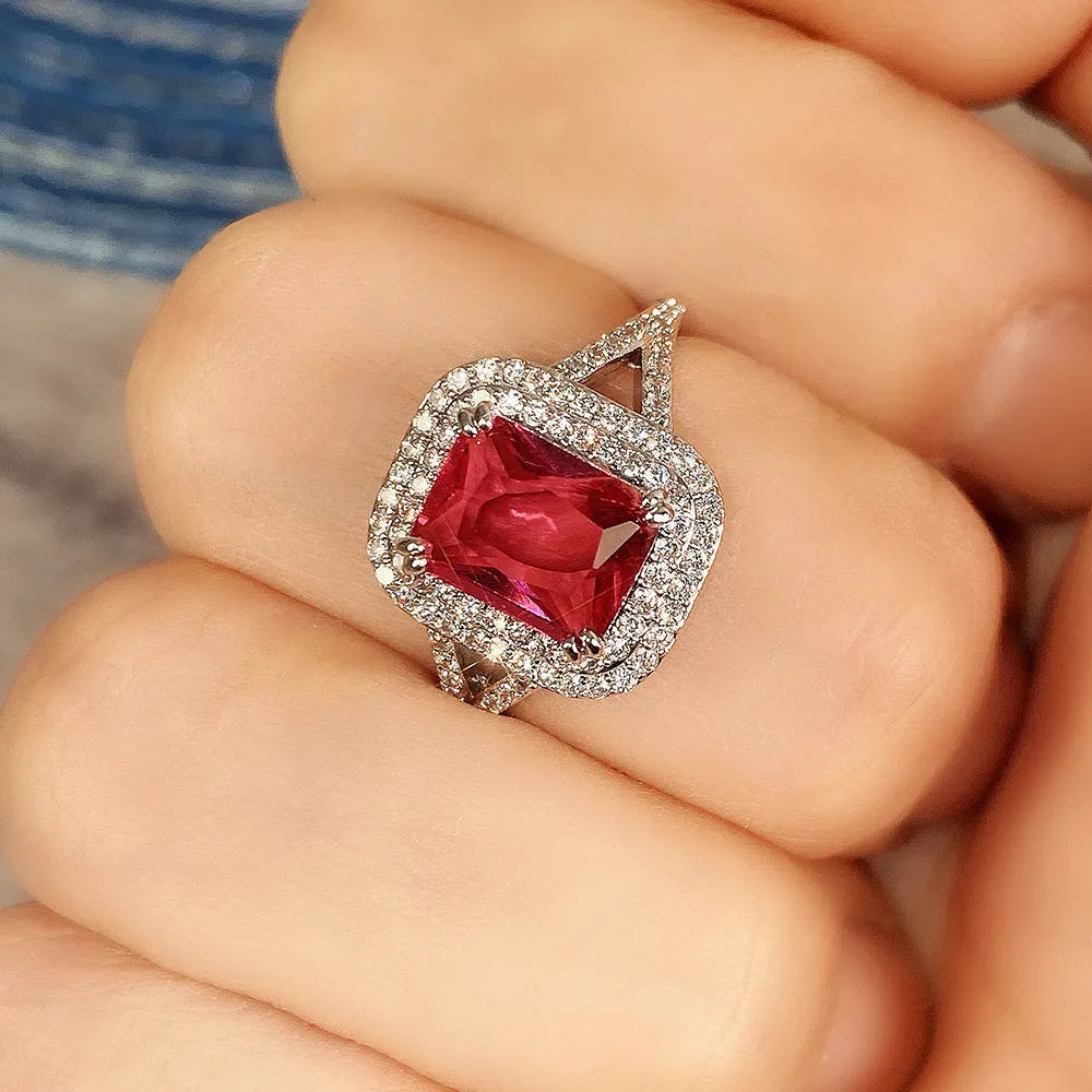 Women's geometric square copper ring with crystal rhinestones in red, showing princess design