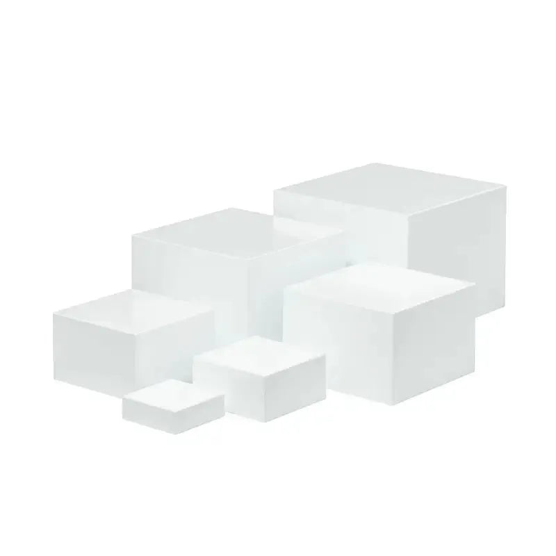 Set of six white plastic cube units forming a tiered desktop dessert display stand.