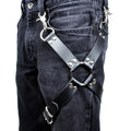 Black PU leather leggings with leather accessories attached to the legs