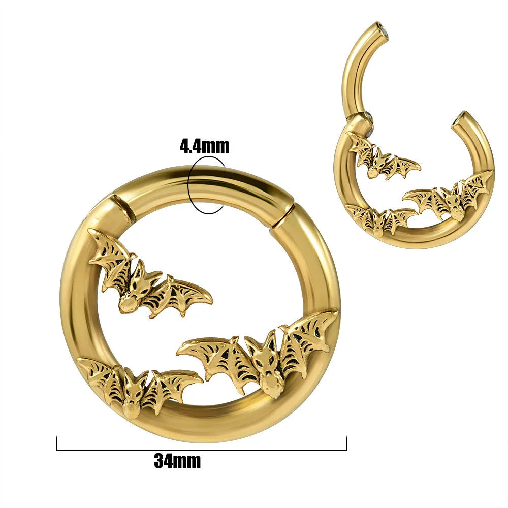 A pair of stainless steel fashion earrings featuring a geometric totem pattern with an electroplated coloured finish.