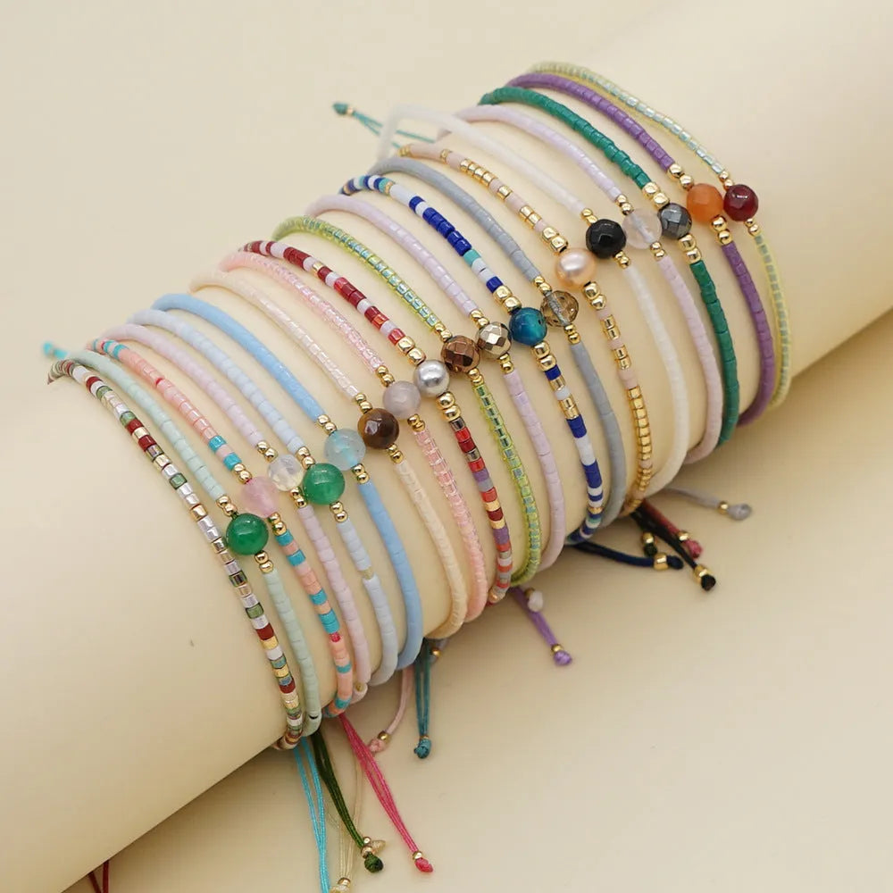 Handmade bohemian style bracelet with colourful geometric glass and coloured glaze beads.