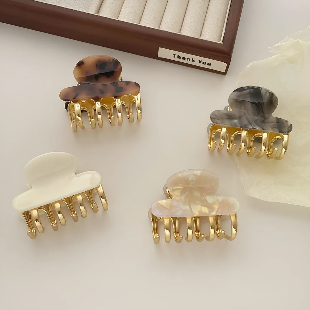 Women's medium metal grip hair barrettes in alloy acrylic with four colour options