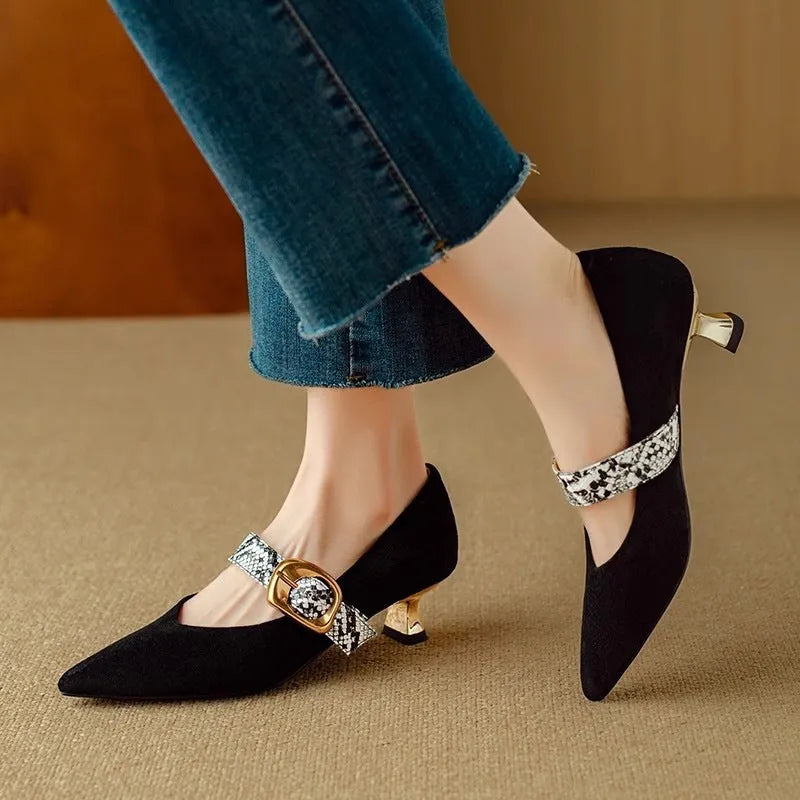 Black pointed toe women's stiletto heels with a buckle fastener on the side.