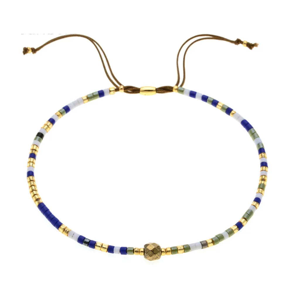 Handmade bohemian style bracelet with colourful geometric glass and coloured glaze beads.