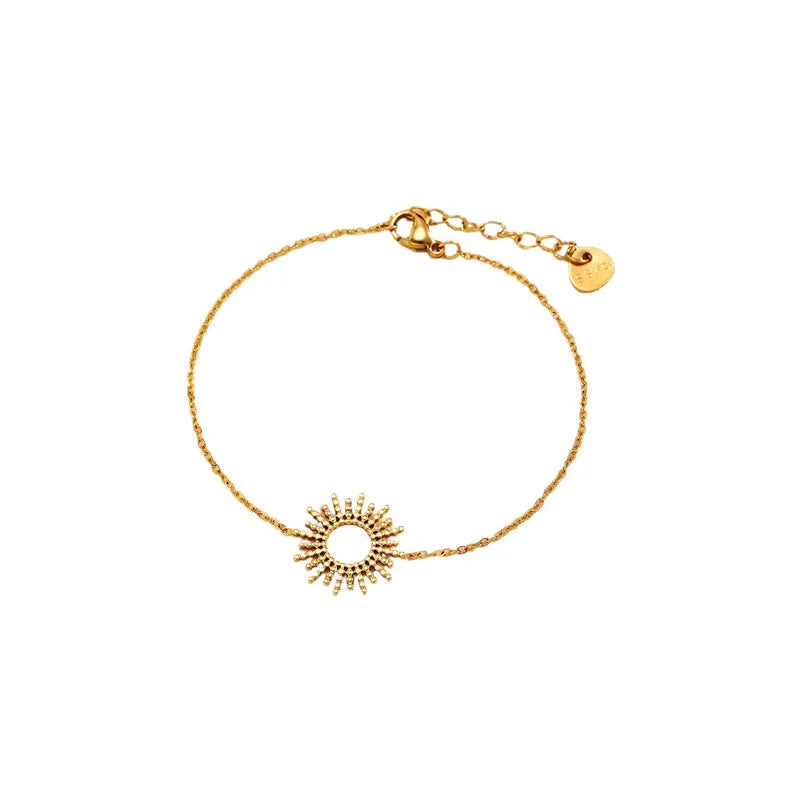 Women's gold geometric sunflower chain necklace and bracelet set on white background