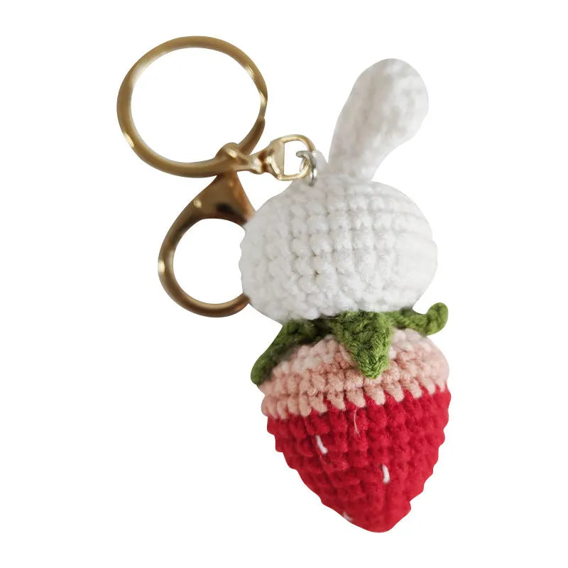 Hand-woven white wire pendant with rabbit strawberry pattern and attached key